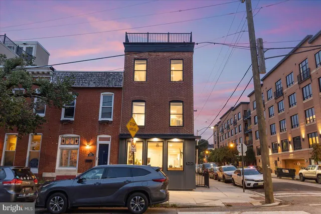 a front view of a building with parking space