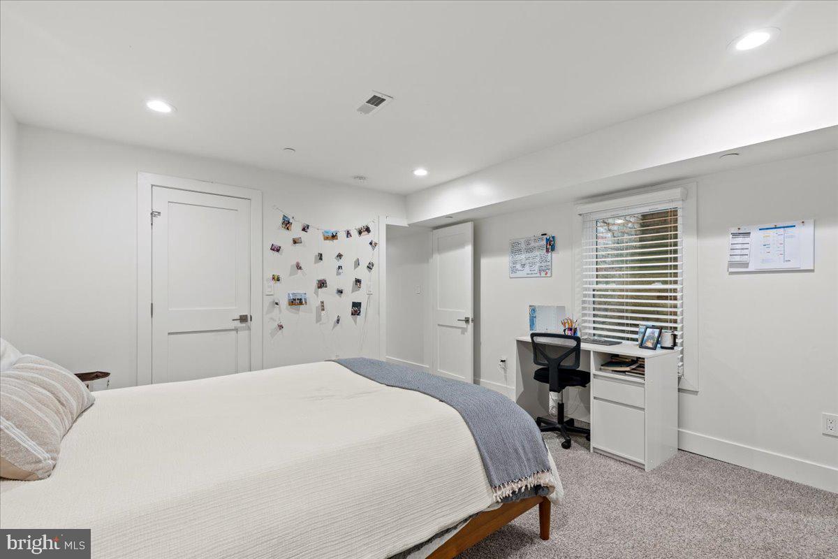 3424 Toone Street Baltimore, MD 21224 - Photo 25 of 87 a bedroom with a bed and furniture