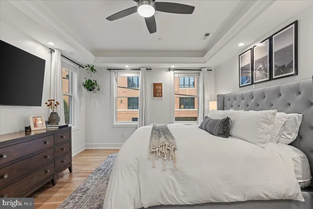 a kitchen with stainless steel appliances kitchen island granite countertop a dining table chairs sink and cabinets