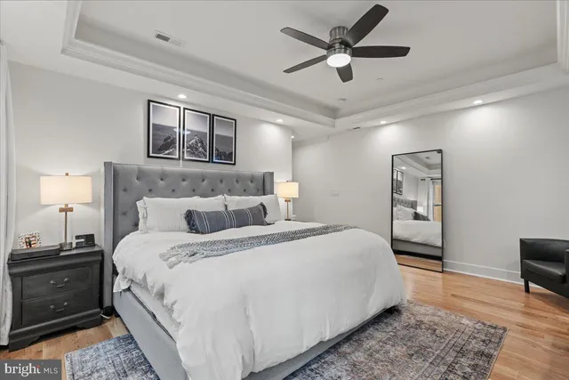 a kitchen with stainless steel appliances granite countertop a sink dishwasher and a stove with white countertops