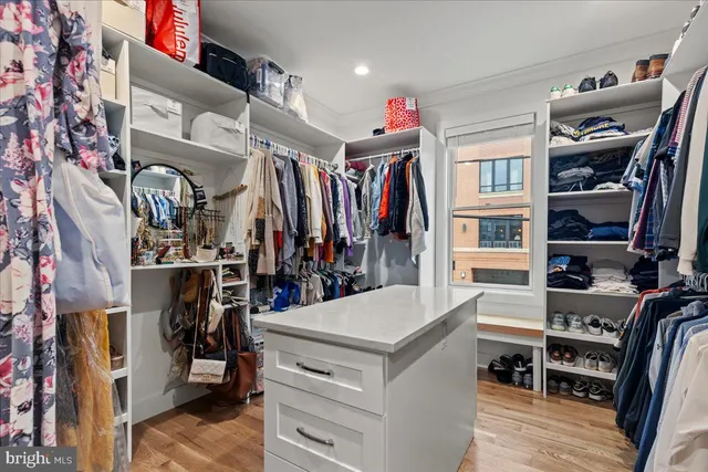 a kitchen with stainless steel appliances granite countertop a stove a microwave and cabinets