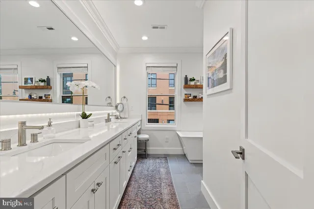 a view of a patio with table and chairs with wooden floor and stairs