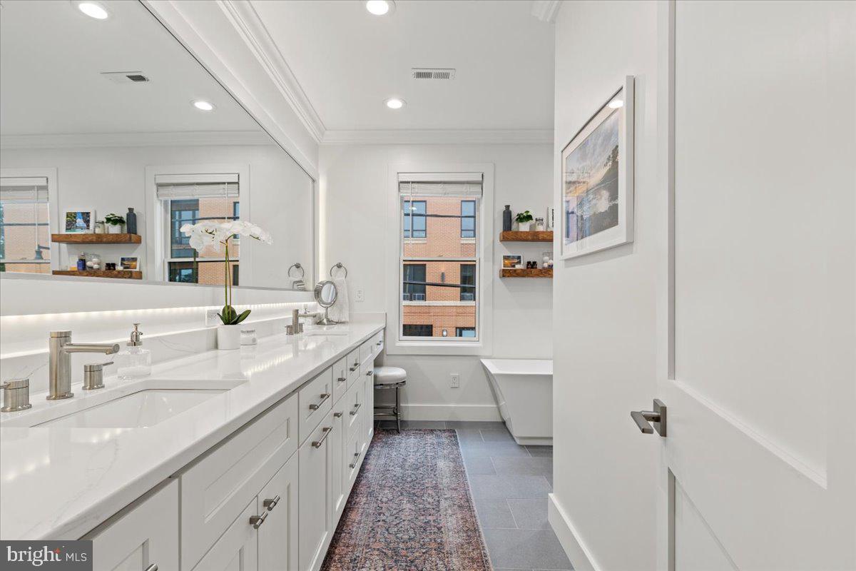 3424 Toone Street Baltimore, MD 21224 - Photo 44 of 87 a large white kitchen with a lot of counter space and a sink