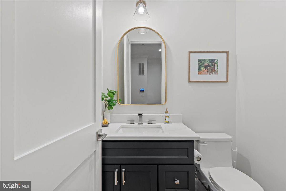 3424 Toone Street Baltimore, MD 21224 - Photo 51 of 87 a bathroom with a sink vanity and toilet