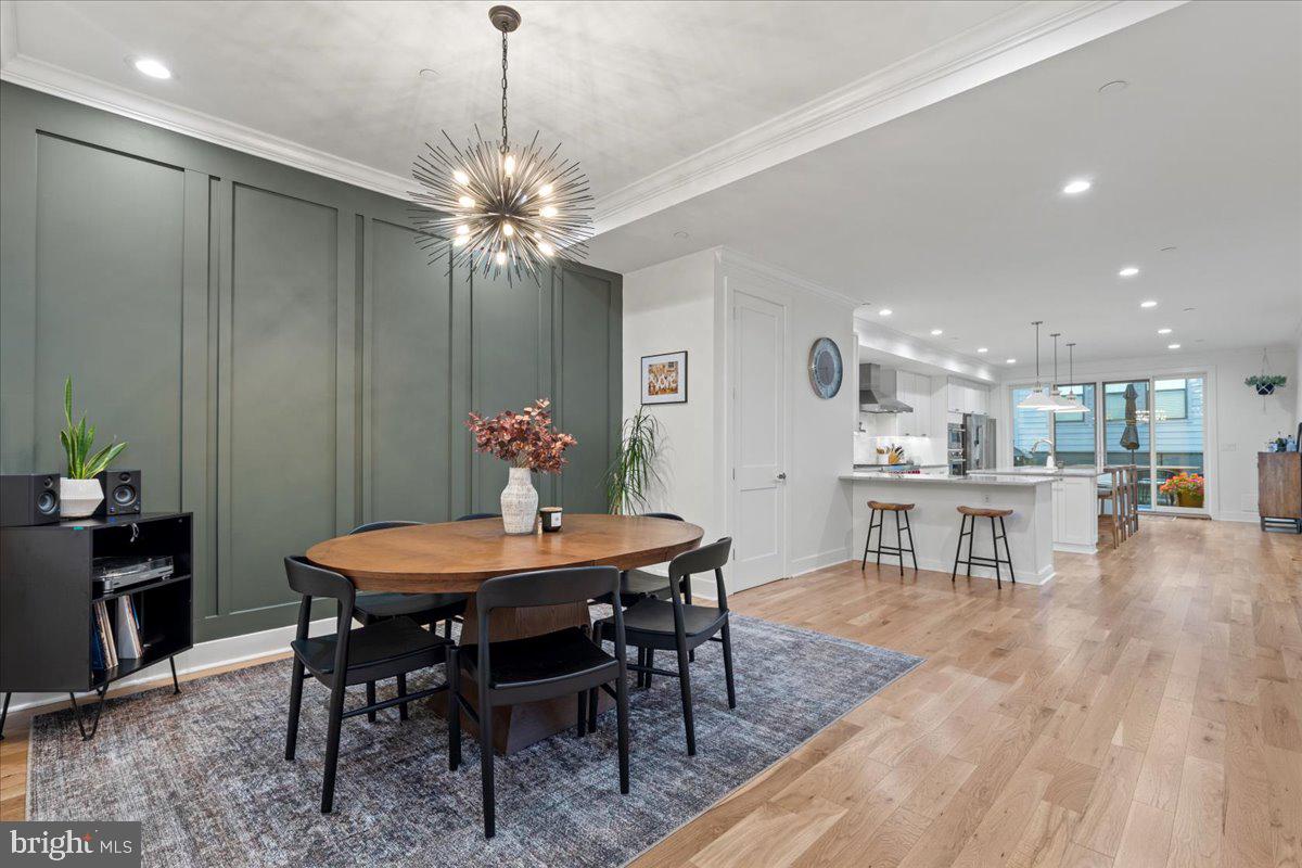 3424 Toone Street Baltimore, MD 21224 - Photo 56 of 87 a view of a dining room with furniture and wooden floor