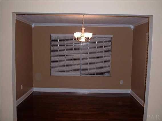 10209 Gallows Road Cantonment, FL 32533 - Photo 11 of 22 Dining rooms ready for all the trimmings. Beautiful Hardwood Floors.