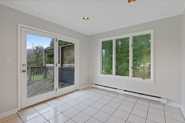 a view of an empty room with windows