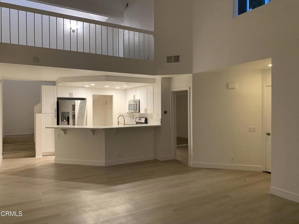 639 Springbrook North, Unit 48 Irvine, CA 92614 - Photo 3 of 12 a view of kitchen and wooden floor