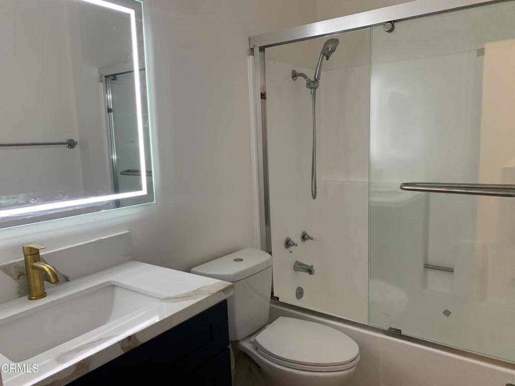 639 Springbrook North, Unit 48 Irvine, CA 92614 - Photo 10 of 12 a bathroom with a sink a toilet and shower