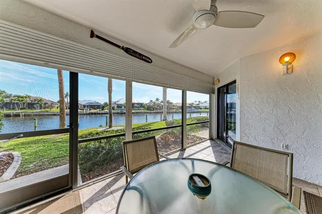 a view of a house with sitting area and garden
