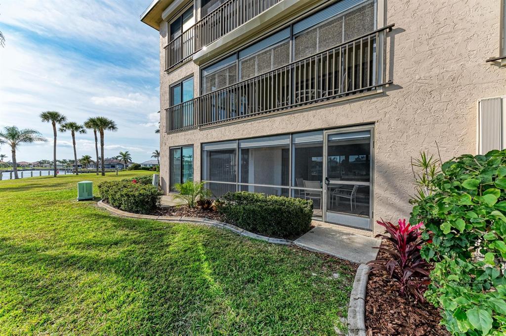 601 Shreve Street, Unit 46A Punta Gorda, FL 33950 - Photo 21 of 23 a view of a house with sitting area and garden