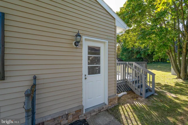 a view of a house with a door and wooden floor