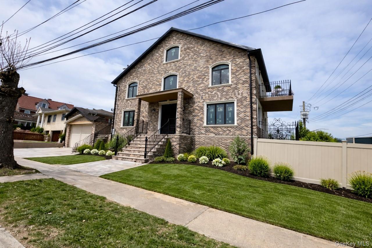 a front view of a house with a yard