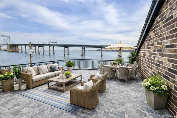 a terrace with outdoor seating and plants