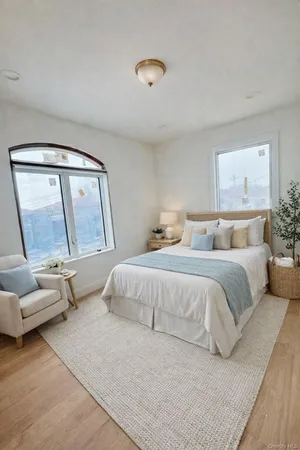 a bedroom with a bed and a mirror
