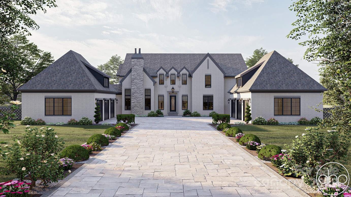 1025 Maxwell Court, Unit 7 Marvin, NC 28173 - Photo 1 of 11 a front view of a house with a yard and garage