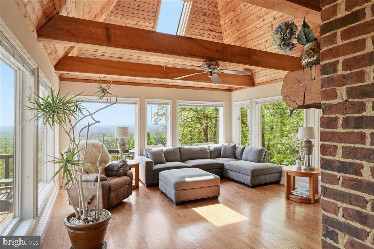 19897 Foresthill Road Bluemont, VA 20135 - Photo 13 of 39 a living room with furniture and a large window