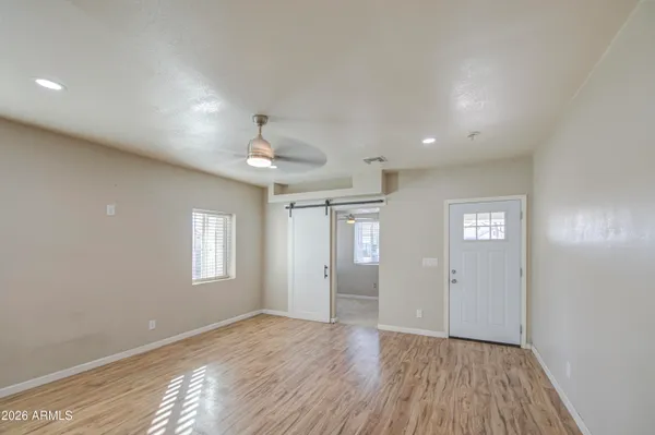 a view of an empty room with a window