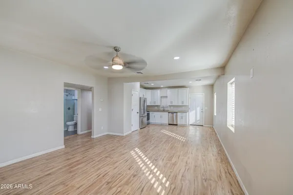 a view of a bedroom with wooden floor and bedroom