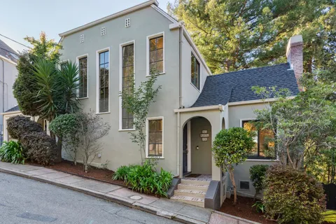 a front view of a house with garden