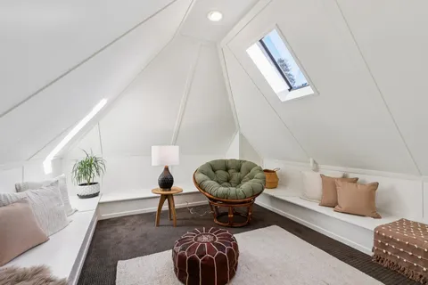 a view of entryway with a window and wooden floor