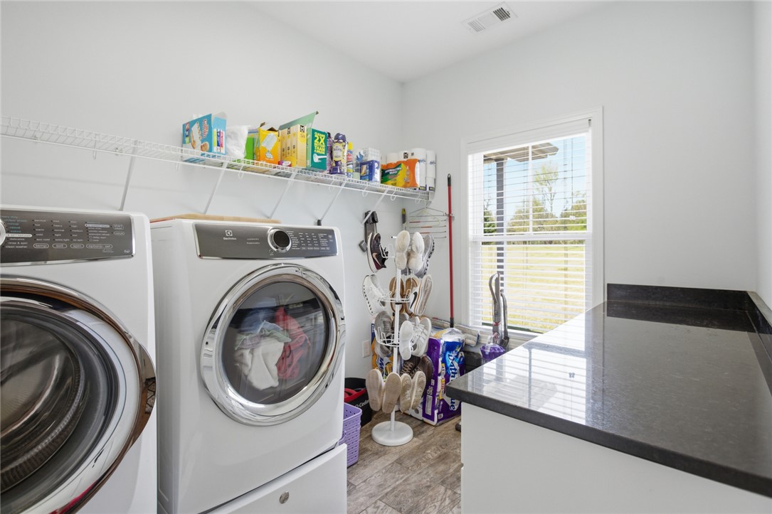 426 Oak Creek Road Seneca, SC 29678 - Photo 14 of 50 Functional laundry space featuring modern appliances and a practical countertop.