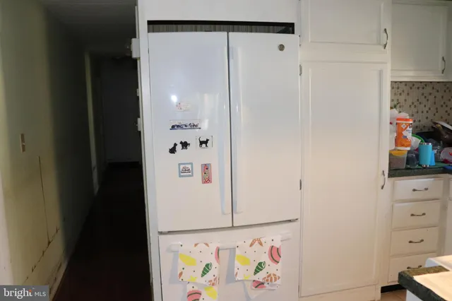 a view of an entryway with cabinets