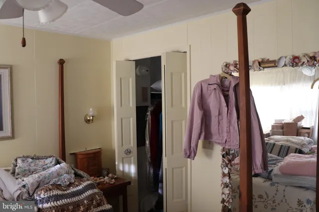 a bedroom with a bed and a closet