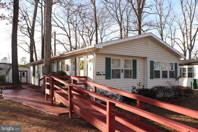 a house view with a seating space and garden space