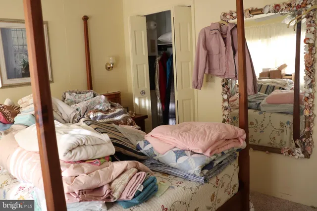 a bed room with a bed and a chair