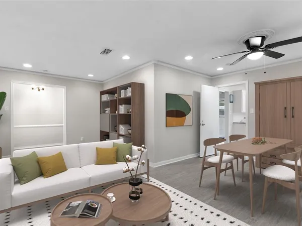 a living room with furniture and wooden floor