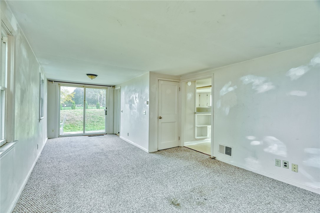 904 Lake Road, Unit 900902 Webster, NY 14580 - Photo 34 of 50 #904 - LIVING ROOM WITH SLIDER TO PATIO