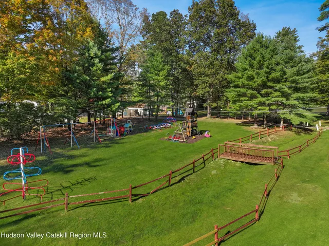 a view of a park with large trees