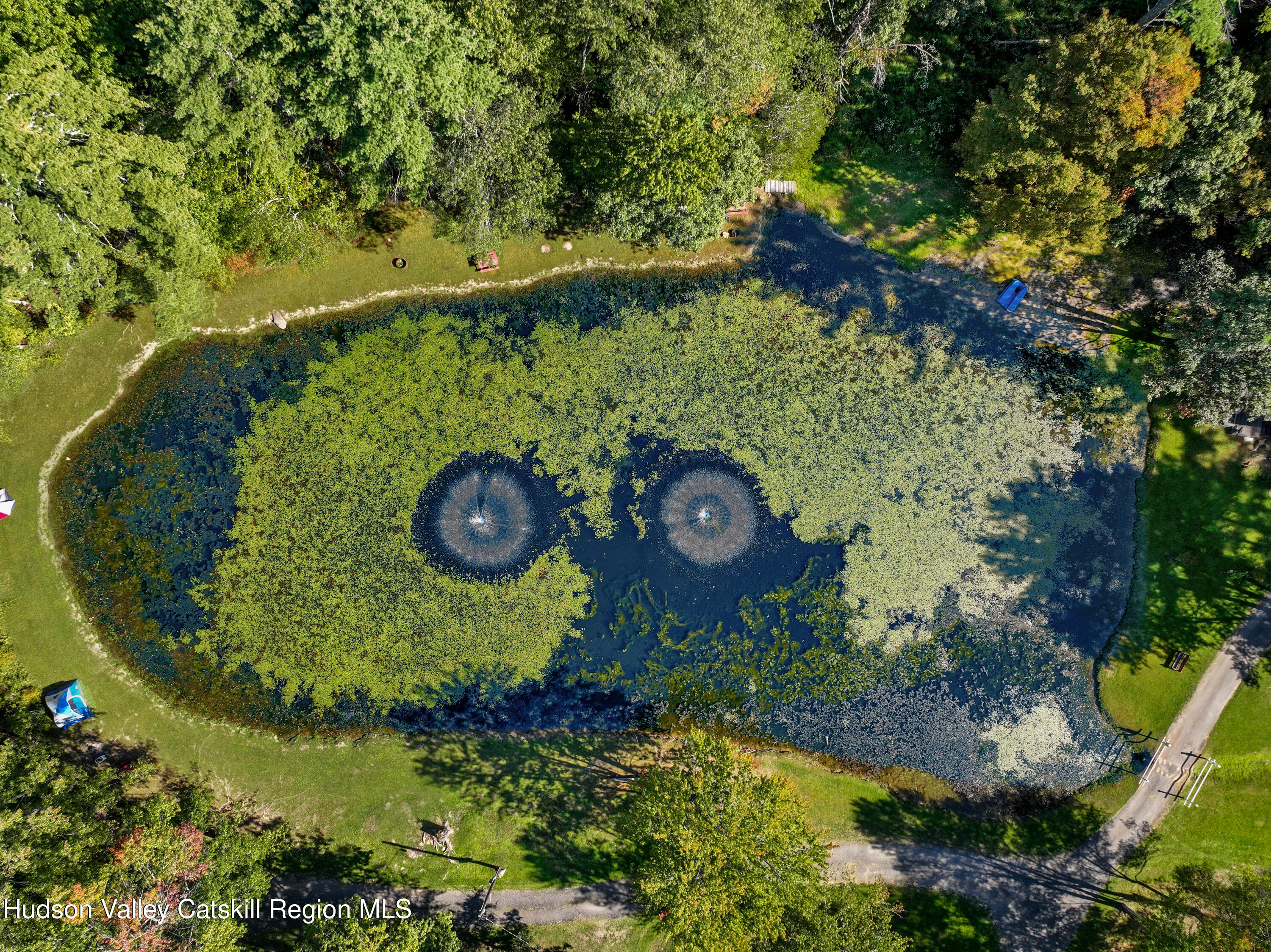 425 Woodland Road Accord, NY 12404 - Photo 25 of 28 an aerial view of a golf course with a swimming pool