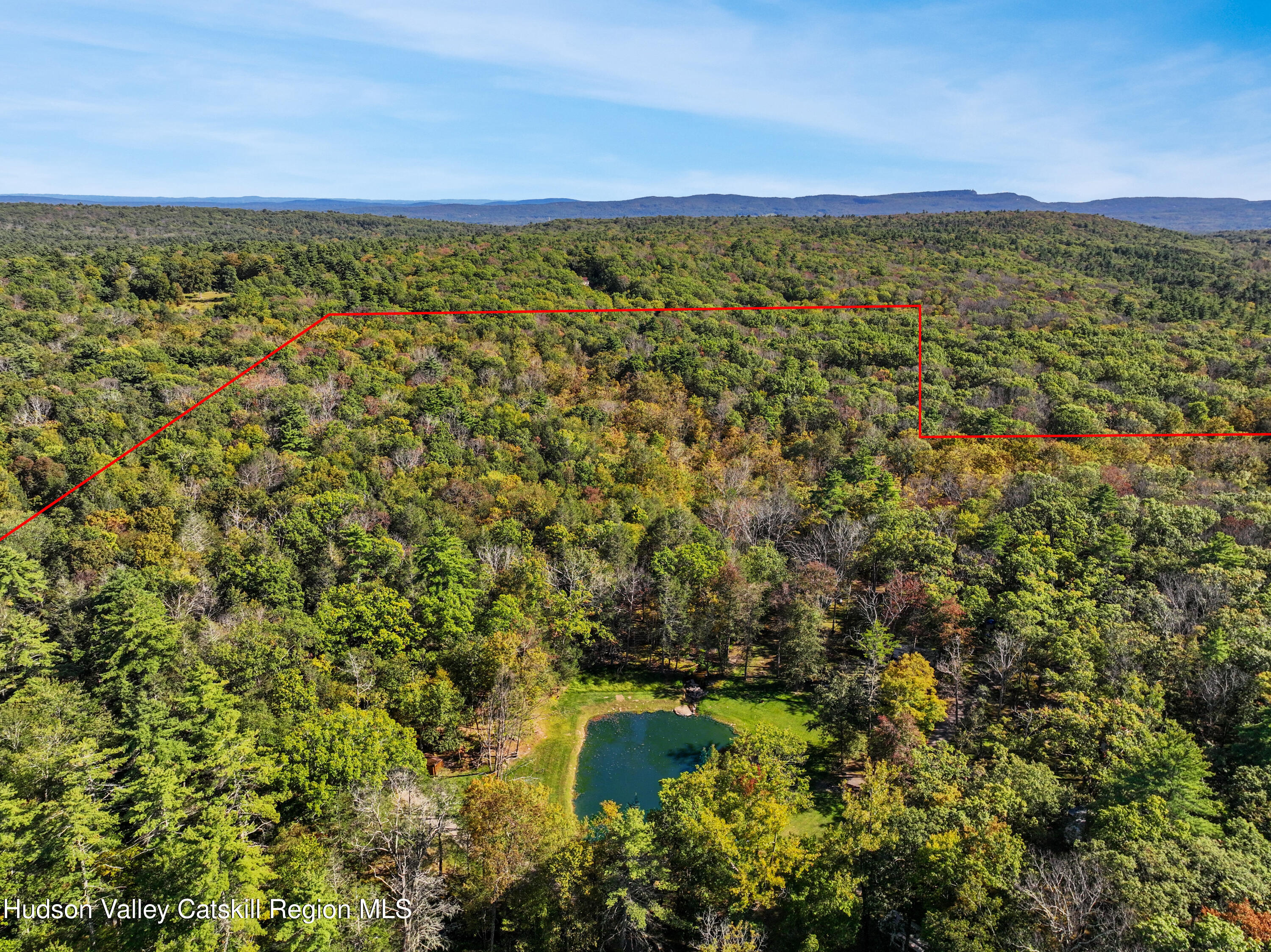 425 Woodland Road Accord, NY 12404 - Photo 26 of 28 a view of a lake with a mountain in the background