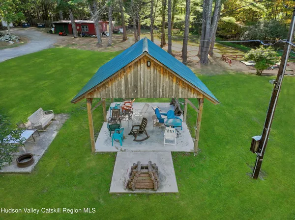 a view of an house with backyard space and sitting area