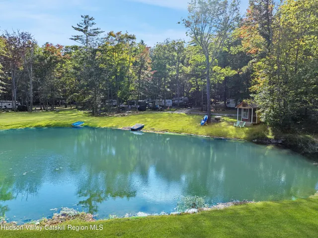 a view of a lake with a house in the background