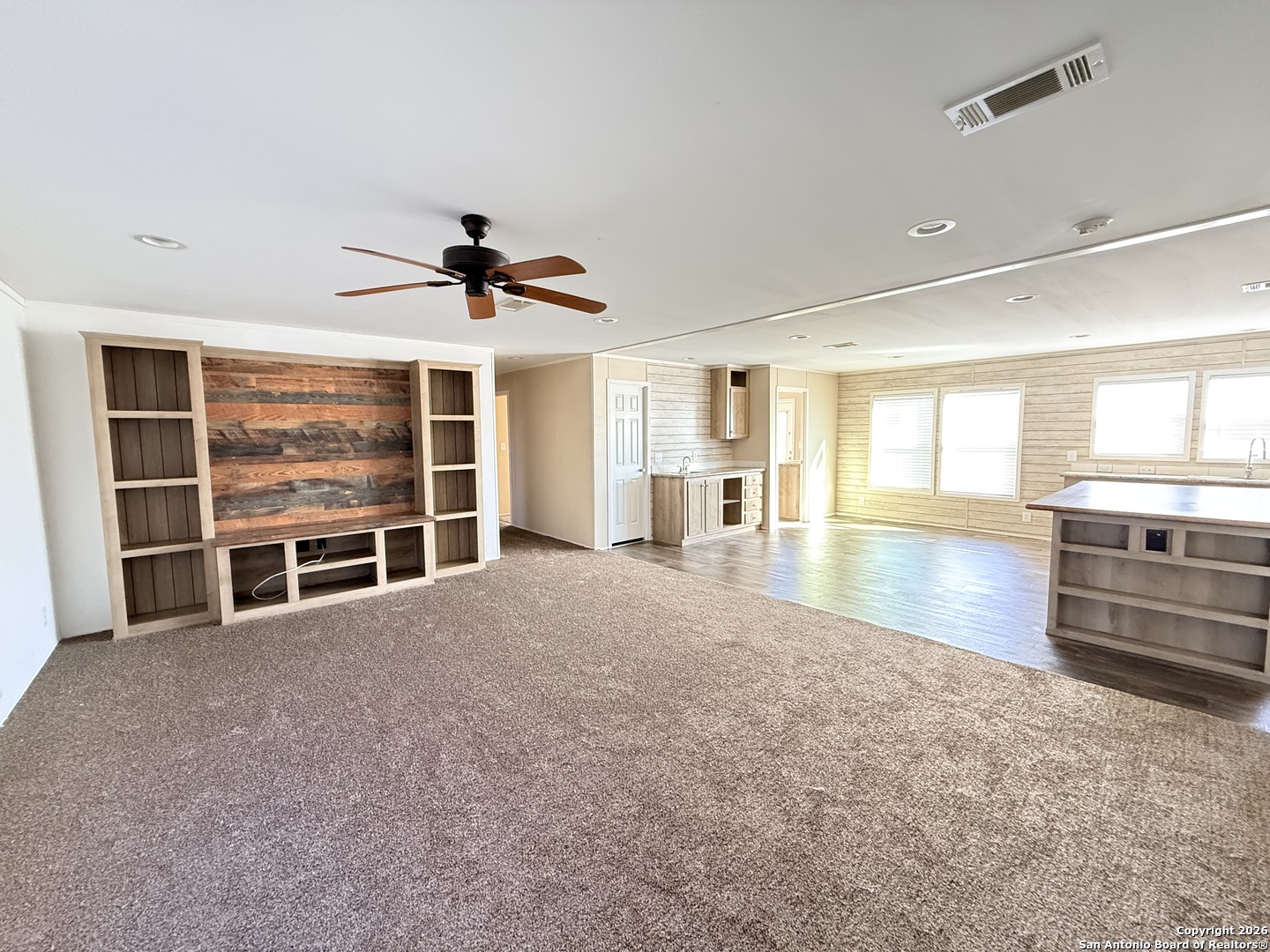 1009 County Road 773 Devine, TX 78016 - Photo 2 of 15 a view of a livingroom with a flat screen tv