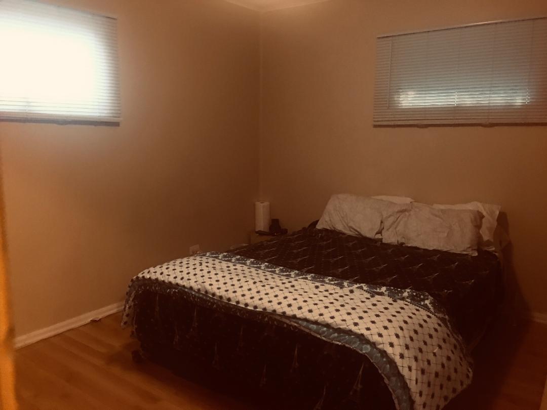 14914 Kedvale Avenue Midlothian, IL 60445 - Photo 8 of 12 a bedroom with a bed and a window