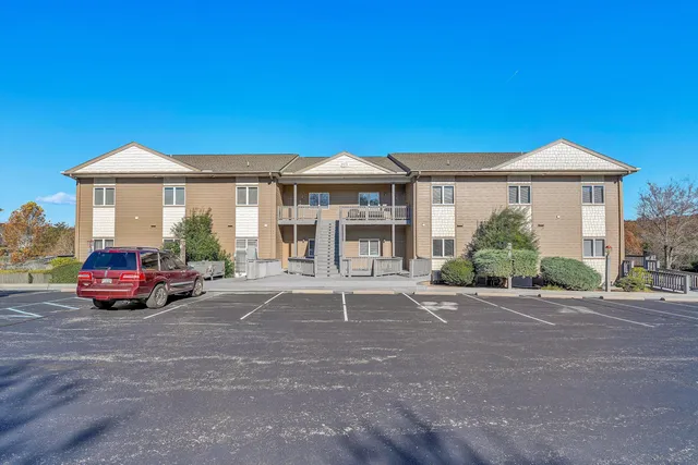 a view of house with a outdoor space and porch