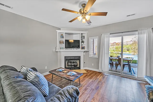 a living room with furniture fireplace and a flat screen tv