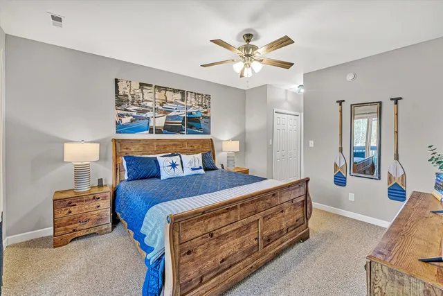 a bed room with a bed and a chandelier