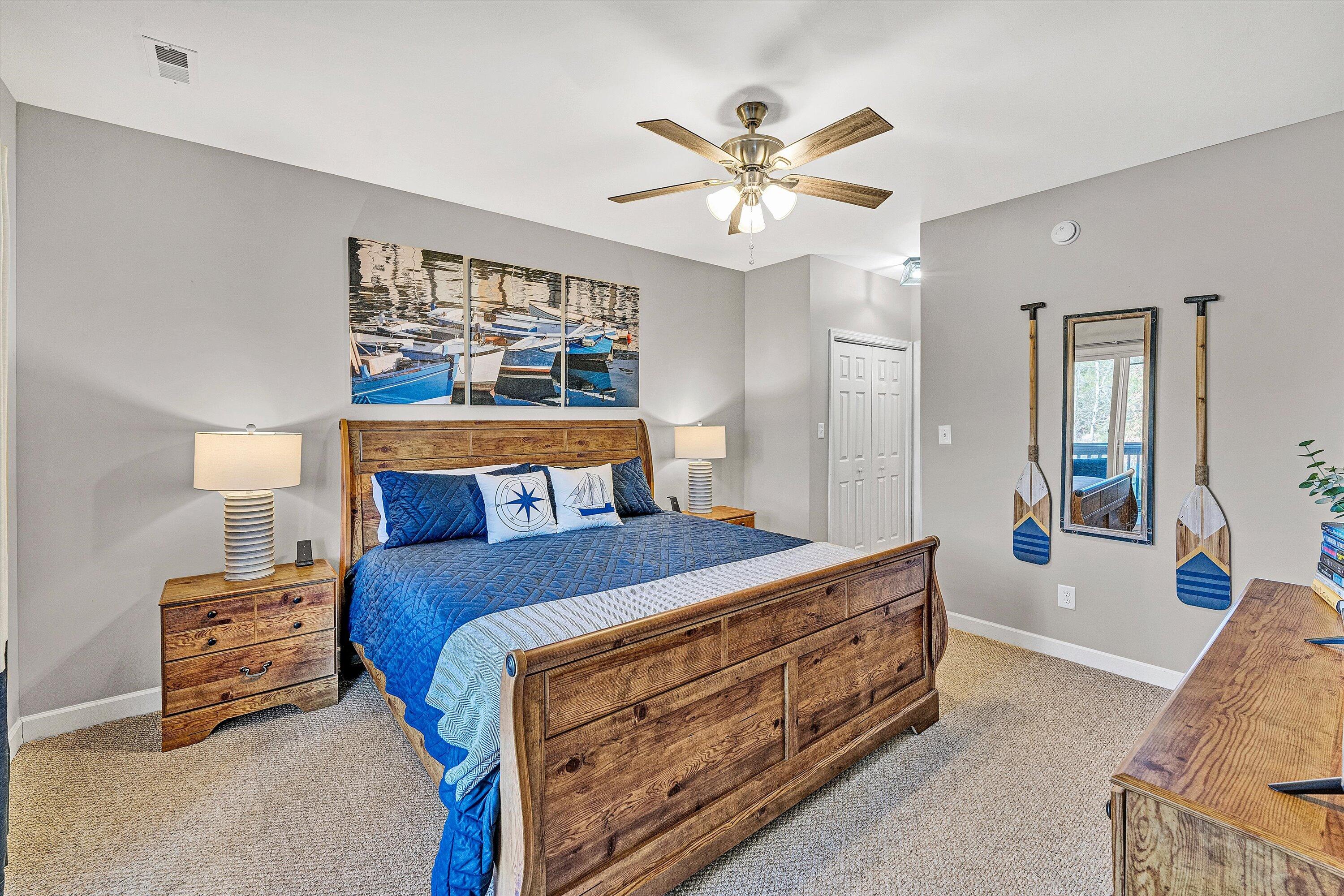 1175 Mariners Way, Unit 59 Huddleston, VA 24104 - Photo 14 of 44 a bed room with a bed and a chandelier