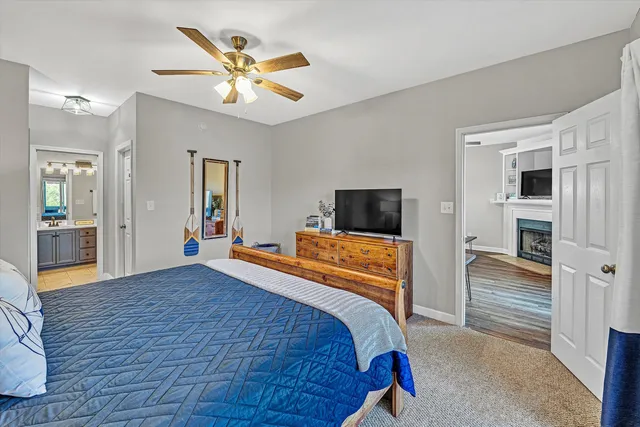 a bedroom with a bed and a television