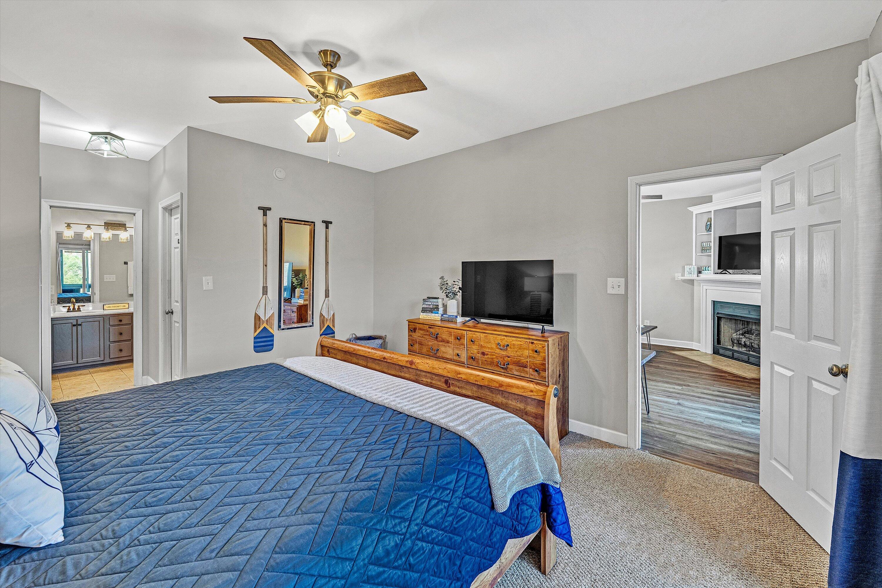 1175 Mariners Way, Unit 59 Huddleston, VA 24104 - Photo 15 of 44 a bedroom with a bed and a television