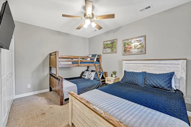 a bedroom with furniture and a chandelier