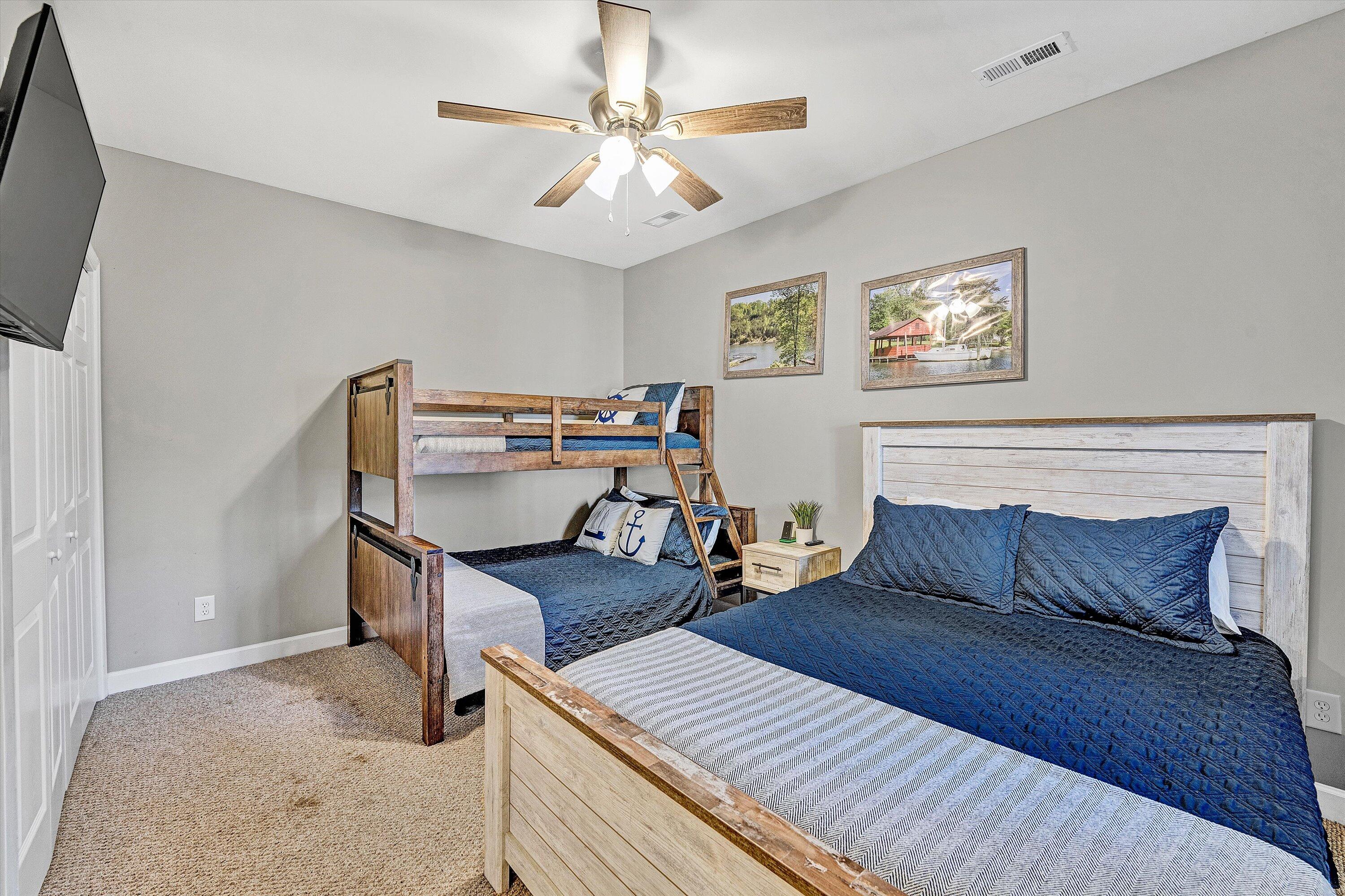 1175 Mariners Way, Unit 59 Huddleston, VA 24104 - Photo 20 of 44 a bedroom with furniture and a chandelier