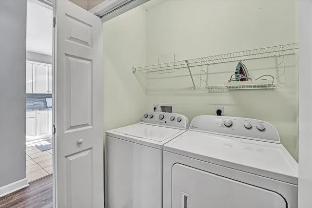 a view of storage and utility room with washer and dryer