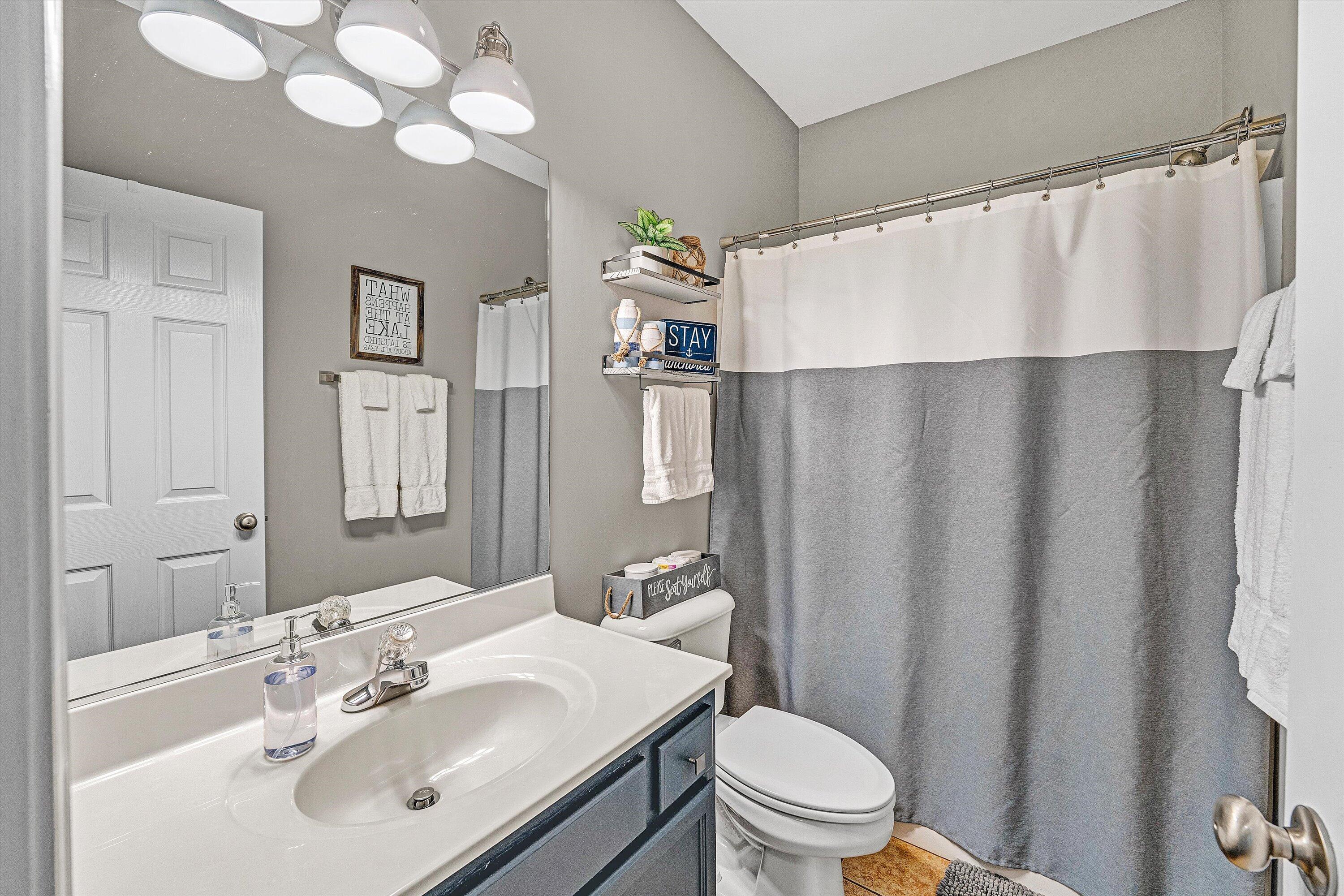 1175 Mariners Way, Unit 59 Huddleston, VA 24104 - Photo 23 of 44 a bathroom with a sink a toilet and a mirror