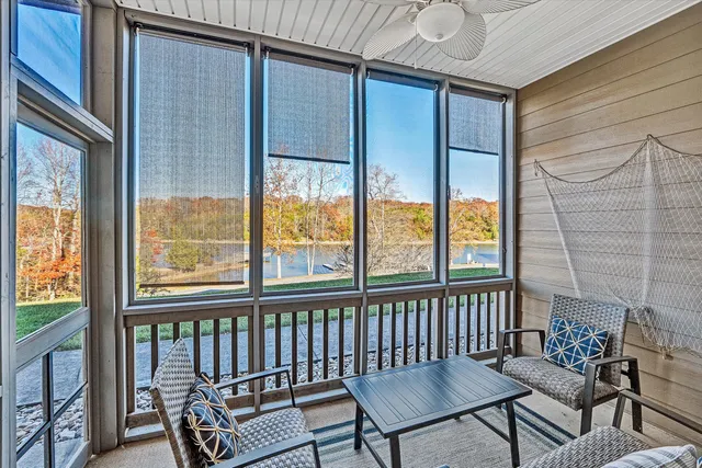 a view of a porch with furniture and a window
